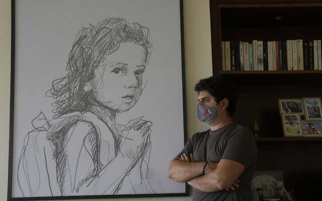 Paul Naggear, stands next a portrait of his daughter Alexandra, who was killed in 2020 massive blast at Beirut's seaport, during an interview in the town of Beit Mery in the hills east of Beirut, Lebanon, July 12, 2022. (Hassan Ammar/AP) Paul Naggear, stands next a portrait of his daughter Alexandra, who was killed in 2020 massive blast at Beirut's seaport, during an interview in the town of Beit Mery in the hills east of Beirut, Lebanon, July 12, 2022. (Hassan Ammar/AP)