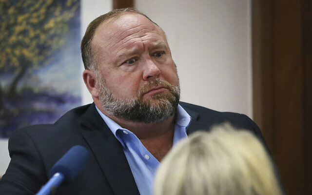 Conspiracy theorist Alex Jones attempts to answer questions about his emails asked by Mark Bankston, lawyer for Neil Heslin and Scarlett Lewis, during trial at the Travis County Courthouse in Austin August 3, 2022. (Briana Sanchez/Austin American-Statesman via AP, Pool) Conspiracy theorist Alex Jones attempts to answer questions about his emails asked by Mark Bankston, lawyer for Neil Heslin and Scarlett Lewis, during trial at the Travis County Courthouse in Austin August 3, 2022. (Briana Sanchez/Austin American-Statesman via AP, Pool)