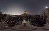 This July 22, 2019, photo taken from video gives a 360-degree view of Ramadan prayers on the plateau of the Dome of the Rock, which can be seen in The Holy City, a virtual reality experience in the metaverse. (The Holy City VR via AP)
