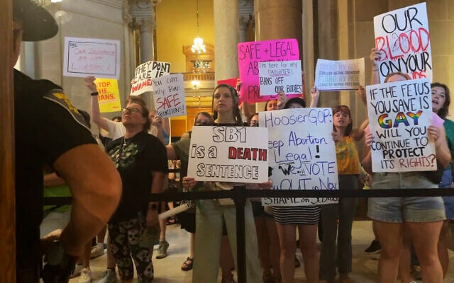 Abortion-rights protesters fill Indiana Statehouse corridors and cheer outside legislative chambers, August 5, 2022, as lawmakers vote to concur on a near-total abortion ban, in Indianapolis. (AP/Arleigh Rodgers) Abortion-rights protesters fill Indiana Statehouse corridors and cheer outside legislative chambers, August 5, 2022, as lawmakers vote to concur on a near-total abortion ban, in Indianapolis. (AP/Arleigh Rodgers)