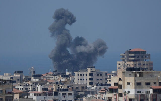 Smoke rises following Israeli airstrikes on a building in Gaza City, August 6, 2022. (AP Photo/Hatem Moussa) Smoke rises following Israeli airstrikes on a building in Gaza City, August 6, 2022. (AP Photo/Hatem Moussa)