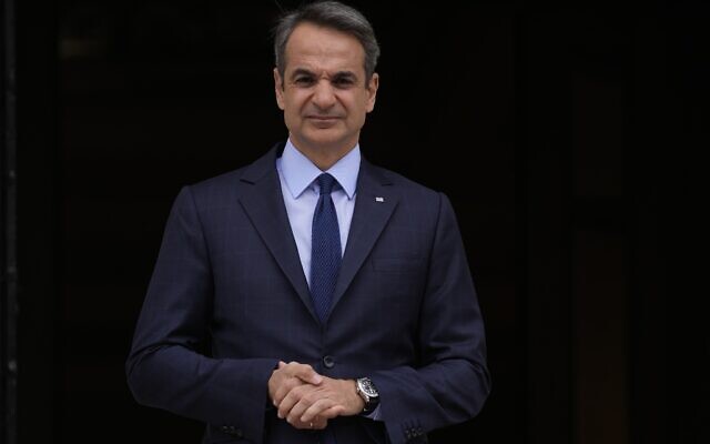 Greece's Prime Minister Kyriakos Mitsotakis stands outside Maximos Mansion in Athens, May 6, 2022. (AP Photo/Thanassis Stavrakis, File) Greece's Prime Minister Kyriakos Mitsotakis stands outside Maximos Mansion in Athens, May 6, 2022. (AP Photo/Thanassis Stavrakis, File)