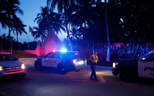 Police direct traffic outside an entrance to former President Donald Trump's Mar-a-Lago estate, Monday, August 8, 2022, in Palm Beach, Fla. Trump said in a lengthy statement that the FBI was conducting a search of his Mar-a-Lago estate. (AP/Terry Renna)