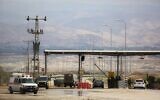 An Israeli soldier stands at the entrance to the Allenby border crossing, the main border crossing for Palestinians from the West Bank traveling to neighboring Jordan and beyond, March 10, 2014. (AP/Sebastian Scheiner)