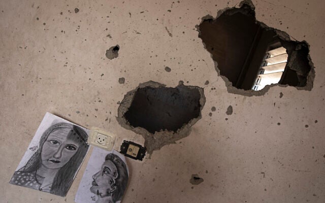 Drawings by Duniana al-Amour are seen in her damaged bedroom which was hit by an Israeli strike, east of Khan Younis, in the southern Gaza Strip, seen Aug. 10, 2022. (Fatima Shbair/AP) Drawings by Duniana al-Amour are seen in her damaged bedroom which was hit by an Israeli strike, east of Khan Younis, in the southern Gaza Strip, seen Aug. 10, 2022. (Fatima Shbair/AP)