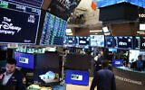 Illustrative: Traders work on the floor at the New York Stock Exchange in New York City, August 10, 2022. (AP/Seth Wenig)