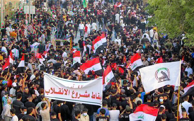 Supporters of Iran-backed Shiite Coordination Framework attend a rally to denounce their rivals, followers of an influential Shiite cleric Muqtada al-Sadr who stormed the parliament last month and have since been holding a sit-in outside the assembly building in Baghdad, Iraq, August 12, 2022. (AP Photo/Anmar Khalil) Supporters of Iran-backed Shiite Coordination Framework attend a rally to denounce their rivals, followers of an influential Shiite cleric Muqtada al-Sadr who stormed the parliament last month and have since been holding a sit-in outside the assembly building in Baghdad, Iraq, August 12, 2022. (AP Photo/Anmar Khalil)
