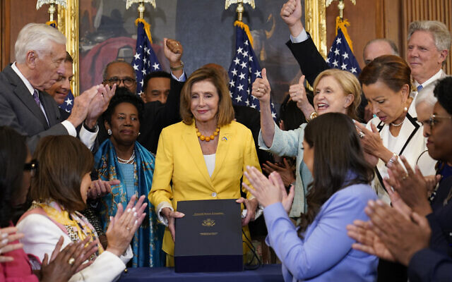 US House Speaker Nancy Pelosi of California, surrounded by House Democrats, poses after signing the Inflation Reduction Act of 2022 during a bill enrollment ceremony on Capitol Hill in Washington, August 12, 2022. (AP Photo/Susan Walsh) US House Speaker Nancy Pelosi of California, surrounded by House Democrats, poses after signing the Inflation Reduction Act of 2022 during a bill enrollment ceremony on Capitol Hill in Washington, August 12, 2022. (AP Photo/Susan Walsh)