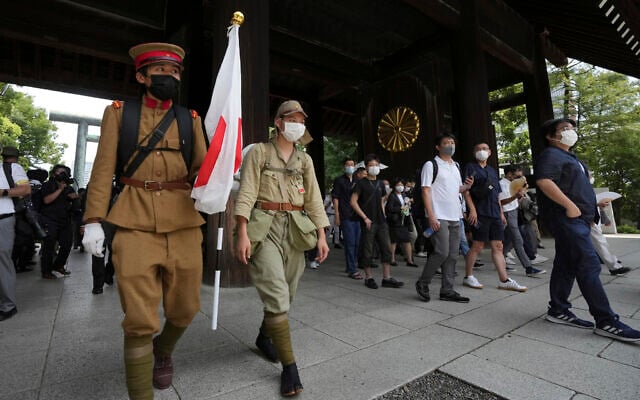 Visitors in old Japanese Imperial army uniforms enter Yasukuni Shrine, which honors Japan's war dead, August 15, 2022, in Tokyo. (AP Photo/Eugene Hoshiko) Visitors in old Japanese Imperial army uniforms enter Yasukuni Shrine, which honors Japan's war dead, August 15, 2022, in Tokyo. (AP Photo/Eugene Hoshiko)
