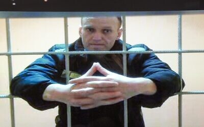 Russian opposition leader Alexei Navalny appears on a video screen set up at Moscow City Court, on May 24, 2022. (Russian Federal Penitentiary Service via AP)
