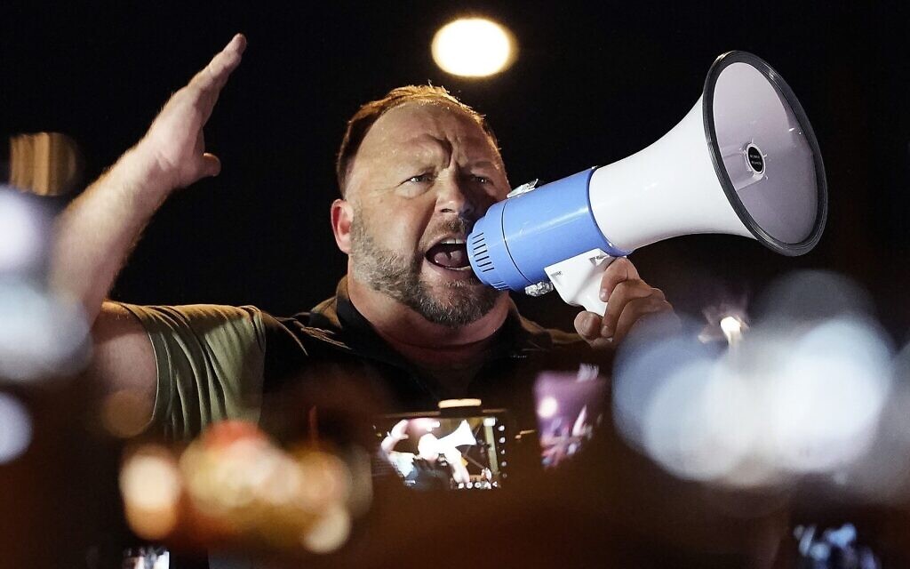 Infowars host and conspiracy theorist Alex Jones rallies pro-Trump supporters, November 5, 2020, in Phoenix, Arizona. (AP Photo/Matt York, File)