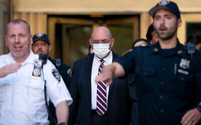 Law enforcement personnel escort the Trump Organization's former Chief Financial Officer Allen Weisselberg, center, as he departs court, Friday, Aug. 12, 2022, in New York. (AP/John Minchillo)