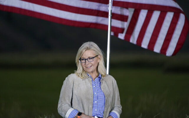 Liz Cheney, a Republican Congresswoman from Wyoming, stands by flags as she waits to speak at a primaries day gathering, Jackson, Wyoming, August 16, 2022. (AP/Jae C. Hong) Liz Cheney, a Republican Congresswoman from Wyoming, stands by flags as she waits to speak at a primaries day gathering, Jackson, Wyoming, August 16, 2022. (AP/Jae C. Hong)