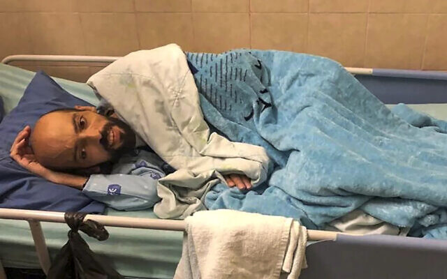 Khalil Awawdeh lies in bed at Asaf Harofeh Hospital in Be'er Ya'akov on August 19, 2022. (Ahlam Haddad, via AP) Khalil Awawdeh lies in bed at Asaf Harofeh Hospital in Be'er Ya'akov on August 19, 2022. (Ahlam Haddad, via AP)
