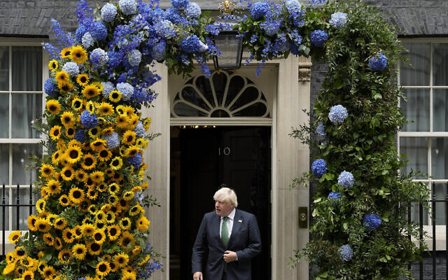 Britains Prime Minister Boris Johnson leaves 10 Downing Street to look at the flower decoration in the national Ukrainian colours one day ahead of the Independence Day of Ukraine in London, Tuesday, Aug. 23, 2022. (AP Photo/Frank Augstein) Britains Prime Minister Boris Johnson leaves 10 Downing Street to look at the flower decoration in the national Ukrainian colours one day ahead of the Independence Day of Ukraine in London, Tuesday, Aug. 23, 2022. (AP Photo/Frank Augstein)