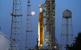 The moon sets in front of the NASA Artemis rocket with the Orion spacecraft aboard on pad 39B at the Kennedy Space Center, Wednesday, June 15, 2022, in Cape Canaveral, Fla. With liftoff planned for Monday, Aug. 29, 2022, the 322-foot rocket will attempt to send an empty crew capsule into a far-flung lunar orbit. (AP/John Raoux, File)