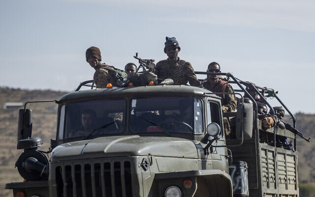 Ethiopian government soldiers ride in the back of a truck on a road near Agula, north of Mekele, in the Tigray region of northern Ethiopia on May 8, 2021. Authorities in Ethiopia's northern Tigray region alleged Wednesday, Aug. 24, 2022 that Ethiopia's military launched a "large-scale" offensive for the first time in a year, while Ethiopia's military spokesman did not immediately respond to questions. (AP Photo/Ben Curtis, File) Ethiopian government soldiers ride in the back of a truck on a road near Agula, north of Mekele, in the Tigray region of northern Ethiopia on May 8, 2021. Authorities in Ethiopia's northern Tigray region alleged Wednesday, Aug. 24, 2022 that Ethiopia's military launched a "large-scale" offensive for the first time in a year, while Ethiopia's military spokesman did not immediately respond to questions. (AP Photo/Ben Curtis, File)