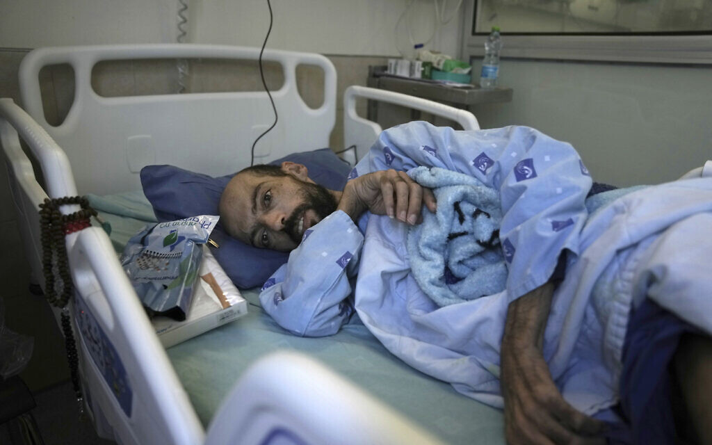 Khalil Awawdeh, a Palestinian who has been on a hunger strike for several months protesting being jailed without charge or trial under what Israel refers to as administrative detention, lies in bed at Asaf Harofeh Hospital in Be'er Ya'akov, Israel, Wednesday, August 24, 2022. (AP/Mahmoud Illean)