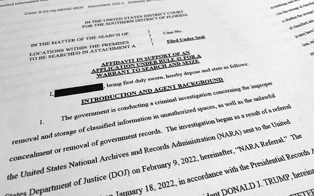 The affidavit by the FBI in support of obtaining a search warrant for former US president Donald Trump's Mar-a-Lago estate, photographed on August 26, 2022. (AP Photo/Jon Elswick) The affidavit by the FBI in support of obtaining a search warrant for former US president Donald Trump's Mar-a-Lago estate, photographed on August 26, 2022. (AP Photo/Jon Elswick)