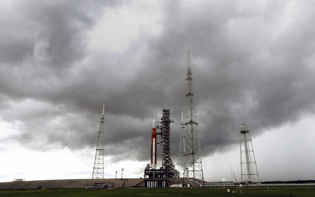 Storm clouds roll in over the NASA moon rocket as it stands ready for launch on Pad 39B for the Artemis 1 mission at the Kennedy Space Center at Cape Canaveral, Florida, August 27, 2022. (AP/John Raoux) Storm clouds roll in over the NASA moon rocket as it stands ready for launch on Pad 39B for the Artemis 1 mission at the Kennedy Space Center at Cape Canaveral, Florida, August 27, 2022. (AP/John Raoux)