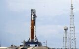 NASA's moon rocket, the most powerful it has ever built stands ready less than 24 hours before it was scheduled to launch on Pad 39B for the Artemis 1 mission to orbit the moon at the Kennedy Space Center at Cape Canaveral, Florida, August 28, 2022. (AP/John Raoux)