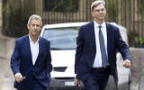 Israeli diamond magnate Beny Steinmetz, left, with his lawyer Daniel Kinzer arrives at a courthouse in Geneva, Switzerland, August 29, 2022. (Salvatore Di Nolfi/Keystone via AP)