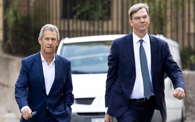 Israeli diamond magnate Beny Steinmetz (left) and his lawyer Daniel Kinzer arrive at a courthouse in Geneva, Switzerland, August 29, 2022. (Salvatore Di Nolfi/Keystone via AP)