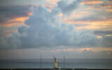 The NASA moon rocket stands ready at sunrise on Pad 39B before the Artemis 1 mission to orbit the moon at the Kennedy Space Center, August 29, 2022, in Cape Canaveral, Florida. (Joel Kowsky/NASA via AP)