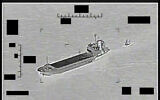 This photo released by the US Navy shows the Iranian Revolutionary Guard ship Shahid Bazair, left, towing a US Navy Saildrone Explorer in the Persian Gulf on August 30, 2022. (US Navy via AP)