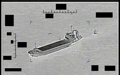 This photo released by the US Navy shows the Iranian Revolutionary Guard ship Shahid Bazair, left, towing a US Navy Saildrone Explorer in the Persian Gulf on August 30, 2022. (US Navy via AP)