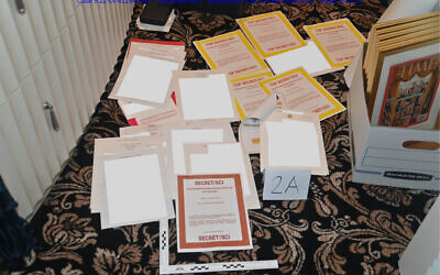 A photo contained in a court filing by the Department of Justice on August 30, 2022, shows documents seized during the August 8 search by the FBI of former president Trump's Mar-a-Lago estate in Florida. (Department of Justice via AP)