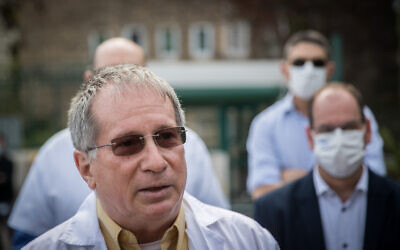 Rambam Medical Center director Michael Halberthal and other hospital directors protest outside the Finance Ministry in Jerusalem on December 13, 2020. (Yonatan Sindel/Flash90)