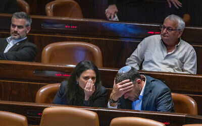 Deputy Minister of Religious Services Matan Kahana speaks with Interior Minister Ayelet Shaked in the Knesset on May 16, 2022. (Olivier Fitoussi/FLASH90)
