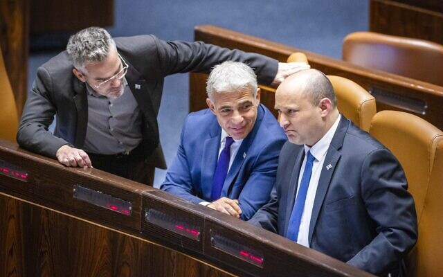 Then-prime minister Naftali Bennett, then-Foreign Affairs Minister Yair Lapid and MK Boaz Toporovsky during a discussion and a vote on a bill to dissolve the Knesset, June 22, 2022. (Olivier Fitoussi/Flash90) Then-prime minister Naftali Bennett, then-Foreign Affairs Minister Yair Lapid and MK Boaz Toporovsky during a discussion and a vote on a bill to dissolve the Knesset, June 22, 2022. (Olivier Fitoussi/Flash90)