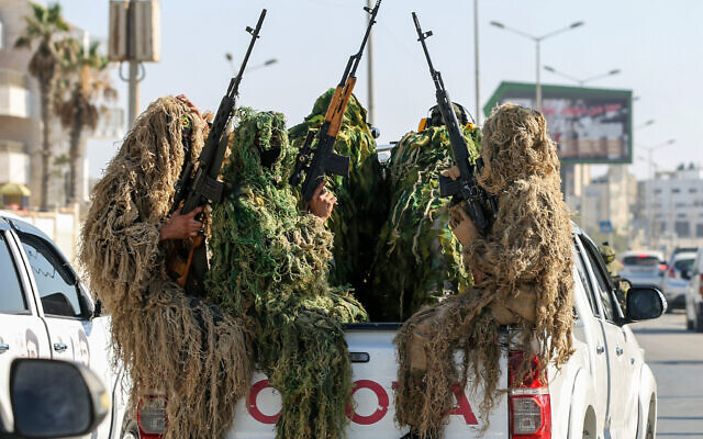 Members of the Saraya al-Quds Brigades, the armed wing of the Palestine Islamic Jihad movement, take part in a military parade. in Al-Shati refugee camp, west of Gaza City, on June 24, 2022. (Attia Muhammed/Flash90) Members of the Saraya al-Quds Brigades, the armed wing of the Palestine Islamic Jihad movement, take part in a military parade. in Al-Shati refugee camp, west of Gaza City, on June 24, 2022. (Attia Muhammed/Flash90)