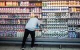 Illustrative: Milk and other dairy products are on display at a Rami Levy supermarket in Jerusalem on July 17, 2022. (Yonatan Sindel/Flash90)