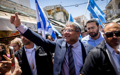 MK Itamar Ben Gvir of the far right Otzma Yehudit party tours the Mahane Yehuda market in Jerusalem on July 22, 2022. (Yonatan Sindel/Flash90)