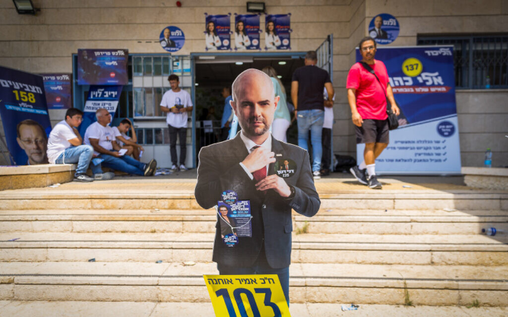 A cardboard cutout of Amir Ohana awaits voters in the Likud primaries at a polling station in Ashdod on August 10, 2022. (Flash90) A cardboard cutout of Amir Ohana awaits voters in the Likud primaries at a polling station in Ashdod on August 10, 2022. (Flash90)