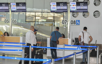West Bank Palestinians prepare to board a flight to Turkey at Israel's Ramon Airport, August 22, 2022. (Flash90) West Bank Palestinians prepare to board a flight to Turkey at Israel's Ramon Airport, August 22, 2022. (Flash90)