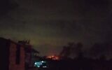 A fire is seen burning near the coastal city of Tartus following a reported Israeli airstrike, August 14, 2022. (Social media)