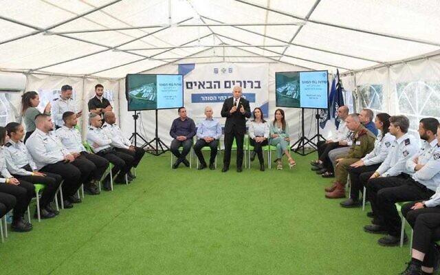 Prime Minister Yair Lapid meets with soldiers in their mandatory service who are serving as prison guards while visiting the Ofer Prison amid the Gilboa Prison scandal, August 2, 2022. (Amos Ben Gershom/GPO) Prime Minister Yair Lapid meets with soldiers in their mandatory service who are serving as prison guards while visiting the Ofer Prison amid the Gilboa Prison scandal, August 2, 2022. (Amos Ben Gershom/GPO)