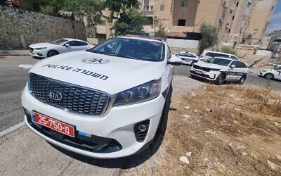 Police cruisers in Jerusalem's Ramot neighborhood, where a 4-year-old boy was critically hurt after allegedly being choked by a relative, August 13, 2022. (Israel Police)