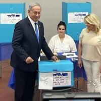 Then opposition leader Benjamin Netanyahu and his wife, Sara, cast their votes in the Likud primary in Tel Aviv, August 10, 2022. (Carrie Keller-Lynn/Times of Israel)