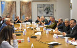 Prime Minister Yair Lapid (second from right) meets top military and government officials during a security cabinet meeting on Operation Breaking Dawn in Gaza, at the Kirya military headquarters in Tel Aviv, August 6, 2022. (Kobi Gideon/GPO)