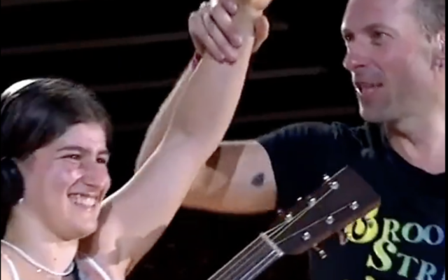 A 15-year-old Israeli girl was invited on stage to perform alongside Coldplay frontman Chris Martin at a concert in Brussels, Belgium, in August 2022 (courtesy) A 15-year-old Israeli girl was invited on stage to perform alongside Coldplay frontman Chris Martin at a concert in Brussels, Belgium, in August 2022 (courtesy)
