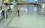 An image taken from security camera footage at an airport believed to show and Iranian agent (C) monitoring Israeli tourists in Turkey in July 2022 (Screen capture/Channel 12)