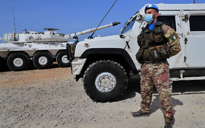 An Italian UN peacekeeper stands guard at a road that links to a UNIFIL base where Lebanese and Israeli delegations meet for negotiations, in Naqoura, Lebanon, May 4, 2021. (AP Photo/Hussein Malla)