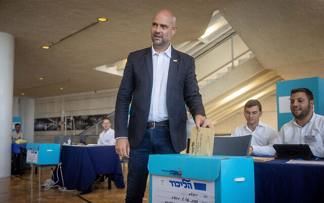 Likud's Amir Ohana casts his vote in the party's primaries at a polling station in Jerusalem on August 10, 2022. (Yonatan Sindel/Flash90)
