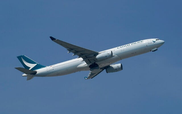 Illustrative: A Cathay Pacific Airways aircraft takes off at the Hong Kong International Airport, in Hong Kong, October 21, 2020. (AP Photo/Kin Cheung) Illustrative: A Cathay Pacific Airways aircraft takes off at the Hong Kong International Airport, in Hong Kong, October 21, 2020. (AP Photo/Kin Cheung)