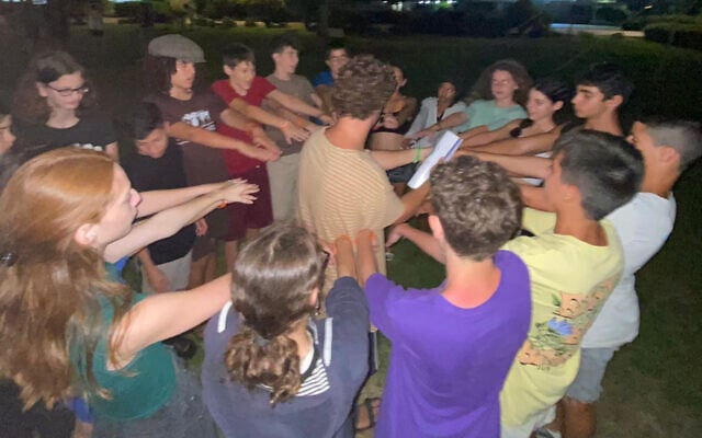Participants at "Camp Hallelujah" on Israel's coast during the summer of 2022. (Jacob Rivkin/Times of Israel)